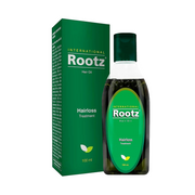 Rootz hair oil bottle and packaging on a white background